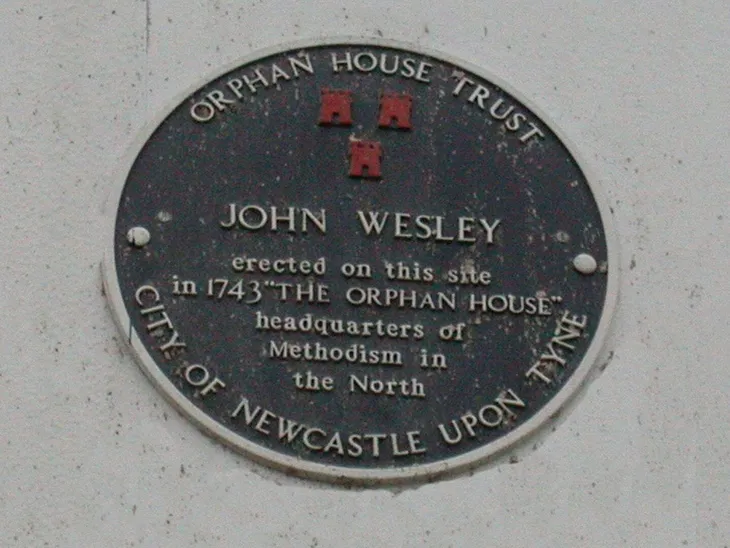 A circular heritage plaque for the Orphan House Trust
