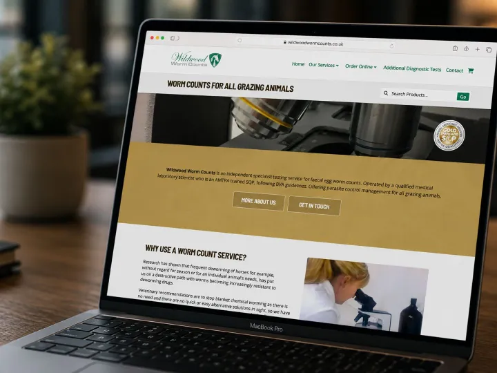 Wildwood Worm Counts website shown on a laptop