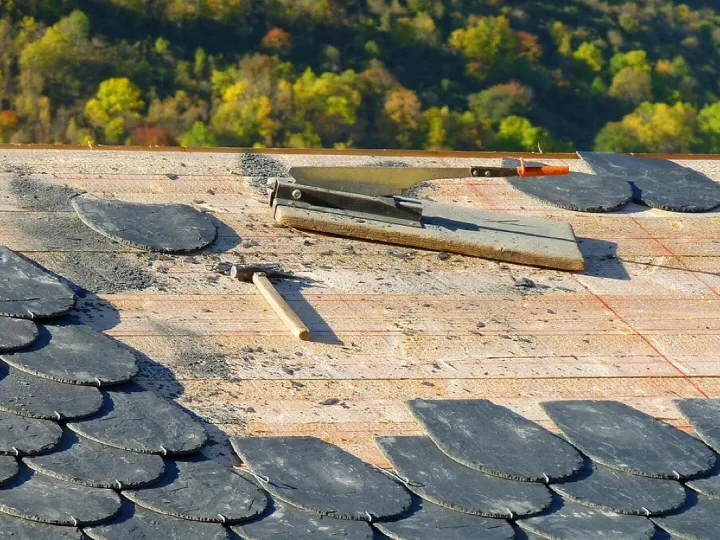Slates being replaced on a chapel roof