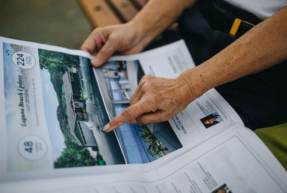 A senior adult's hands holding and reading a