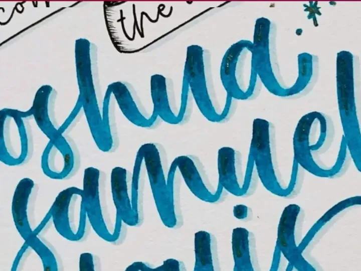 Teal brush lettered name card reading Joshua Samuel on textured paper
