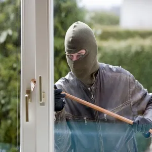 Burglar breaking in
