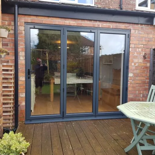 Black patio door with wood decking