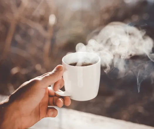steaming coffee mug clay-banks-_wkd7XBRfU4-unsplash