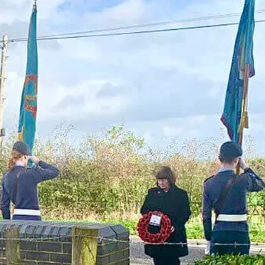 Borough Councillor Janet Clowes laying a wreath