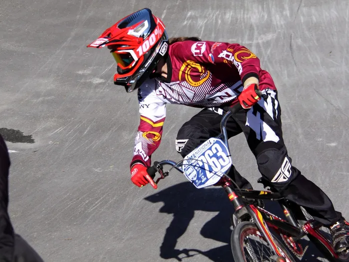 BMX rider in red outfit