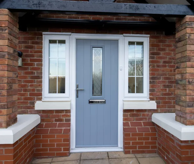 Composite door in blue with bricks