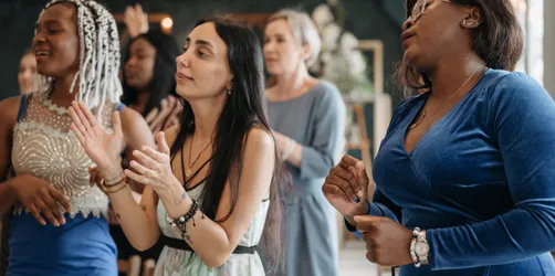 A Group of Women Singing Together