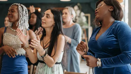 A Group of Women Singing Together