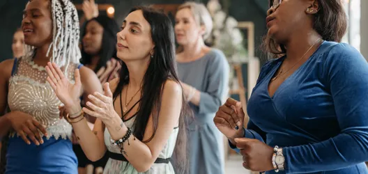A Group of Women Singing Together