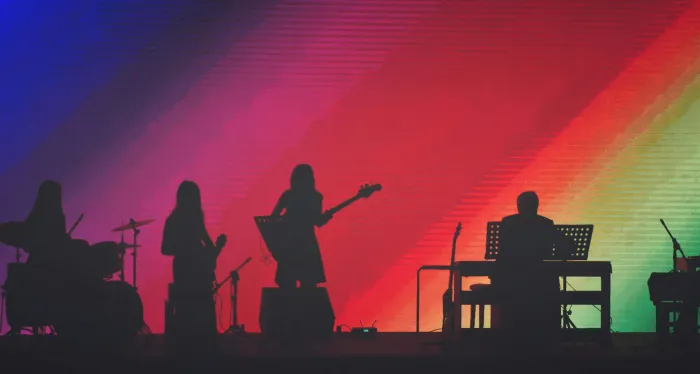 Band Members Playing On Stage