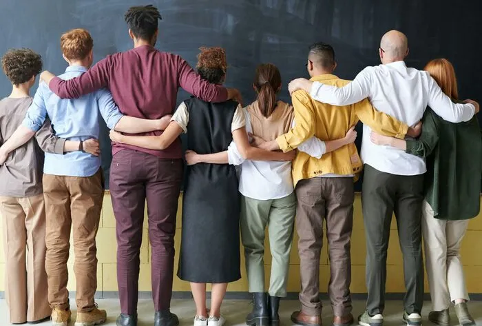 Group of People Standing Indoors