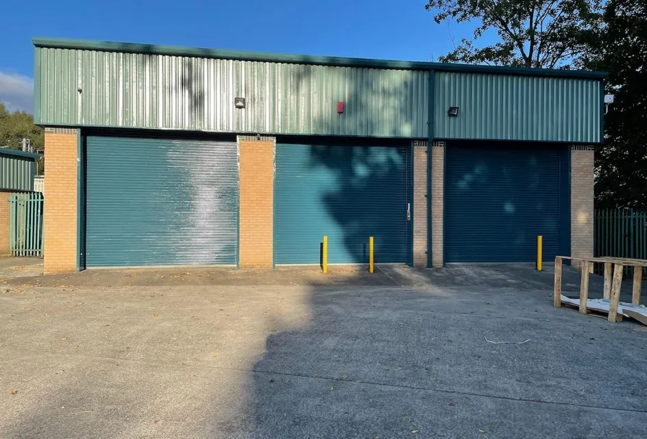 Industrial units with roller shutters and green roofs