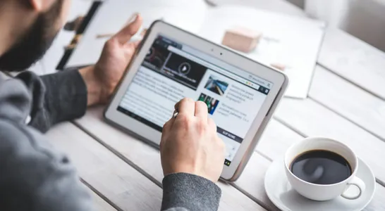 Man using stylus pen for touching the digital tablet screen