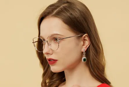 Woman in red wearing metal frame spectacles