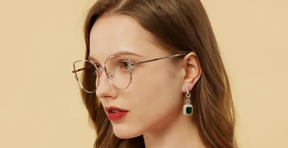 Woman in red wearing metal frame spectacles