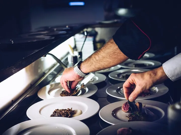Chef plating a dessert