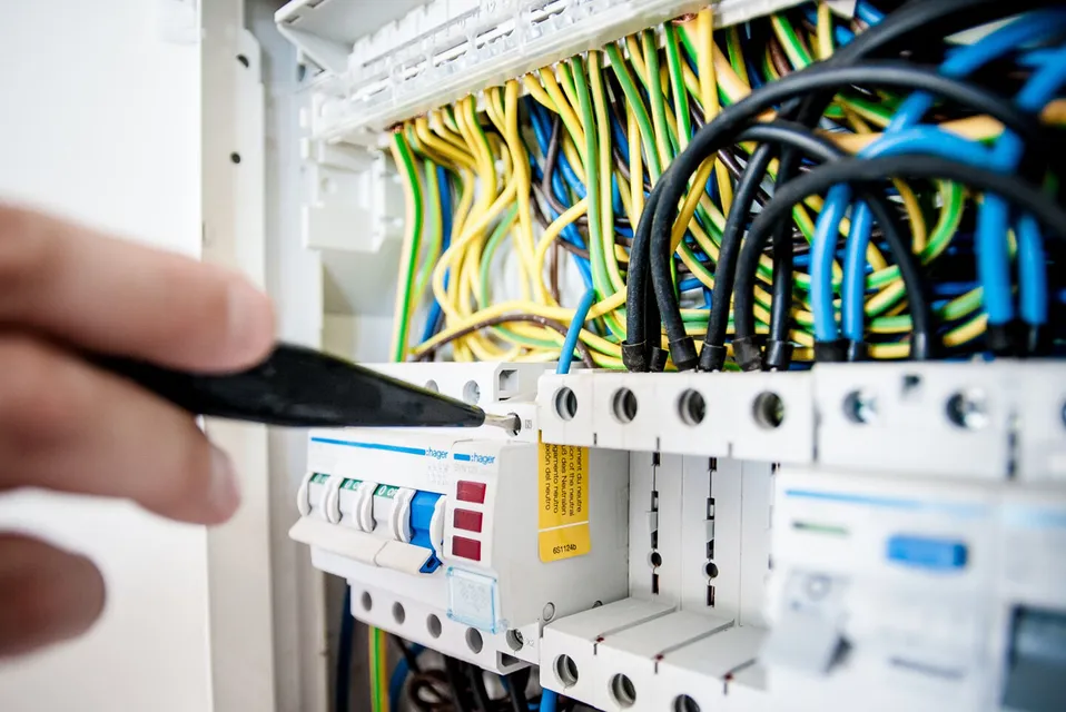 Electrician working on an electric circuit board