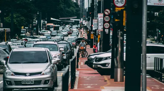 Urban street scene with heavy traffic and