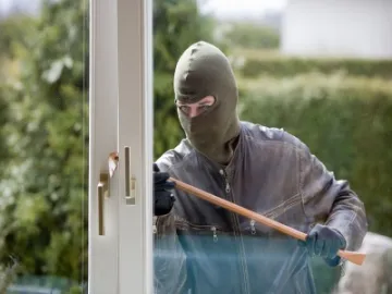 Burglar breaking in