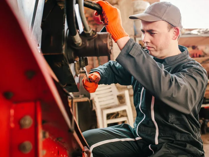 Mechanic in working overalls at work