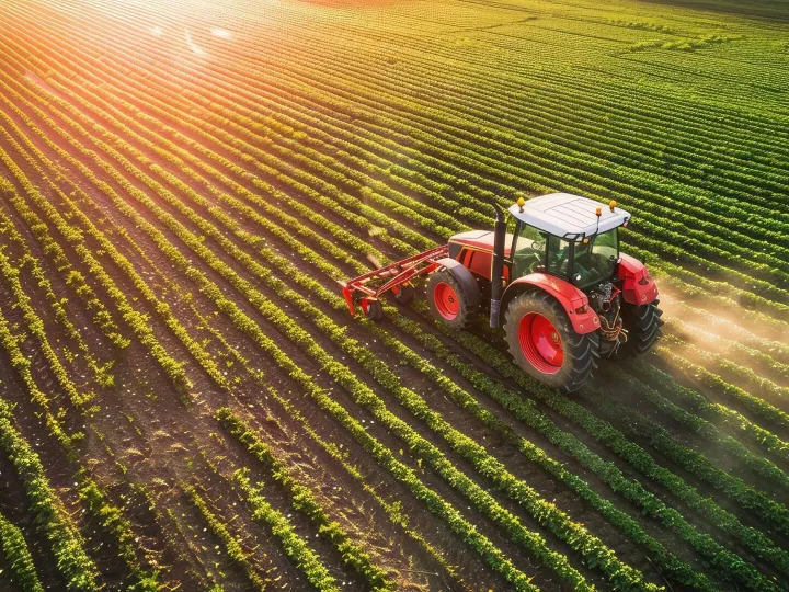 Aerial View of Tractor Fertilizing Cultivated Agricultural F