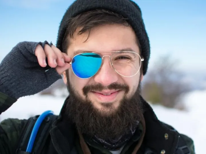 Man with broken sunglasses