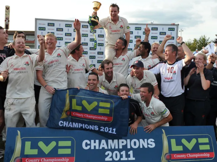 Cricket – LV County Championship – Somerset vs. LancashireThe Lancashire team celebrate with the Championship trophy at the County Ground, Taunton