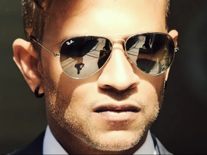 Man wearing Ray-Ban sunglasses