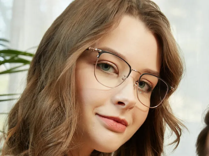 Woman wearing metal frame spectacles