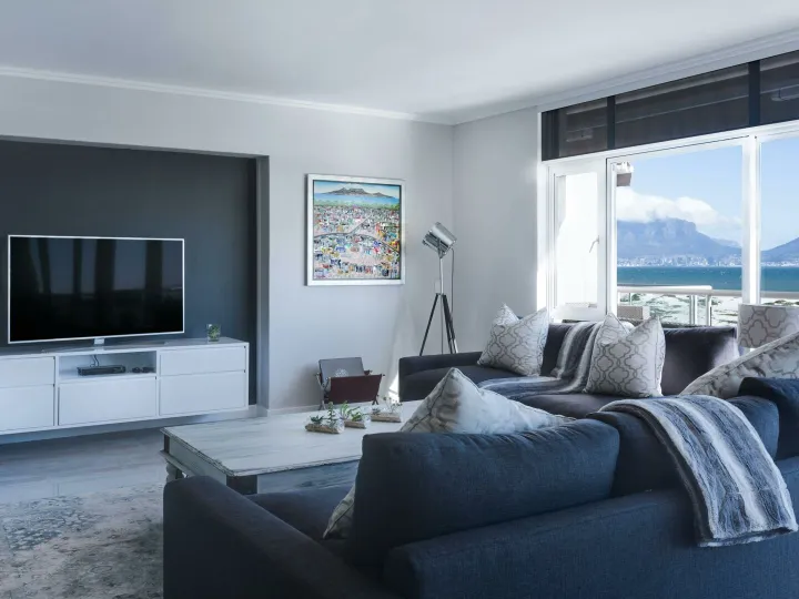 Stylish living room with a view of Table Mountain, blending modern design with natural beauty.