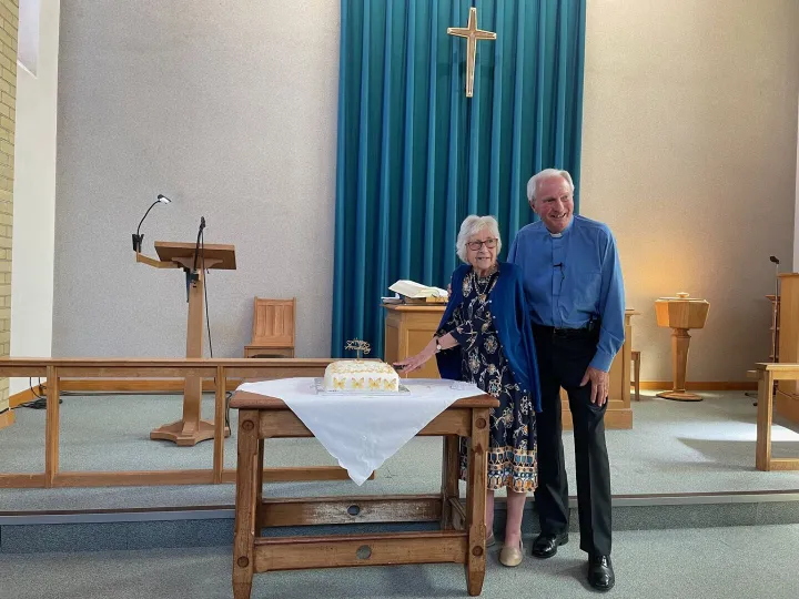 Gill and Rev. David Coote cutting cake