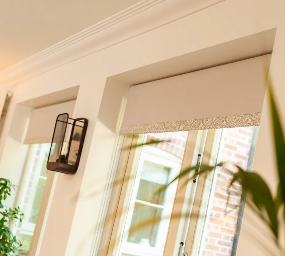Peach blinds on peach wall