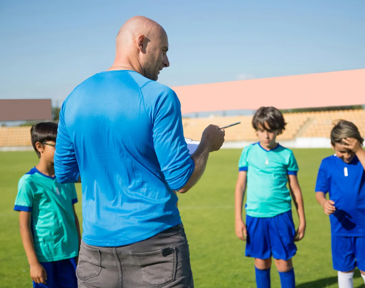 A Man Coaching His Team on the Field