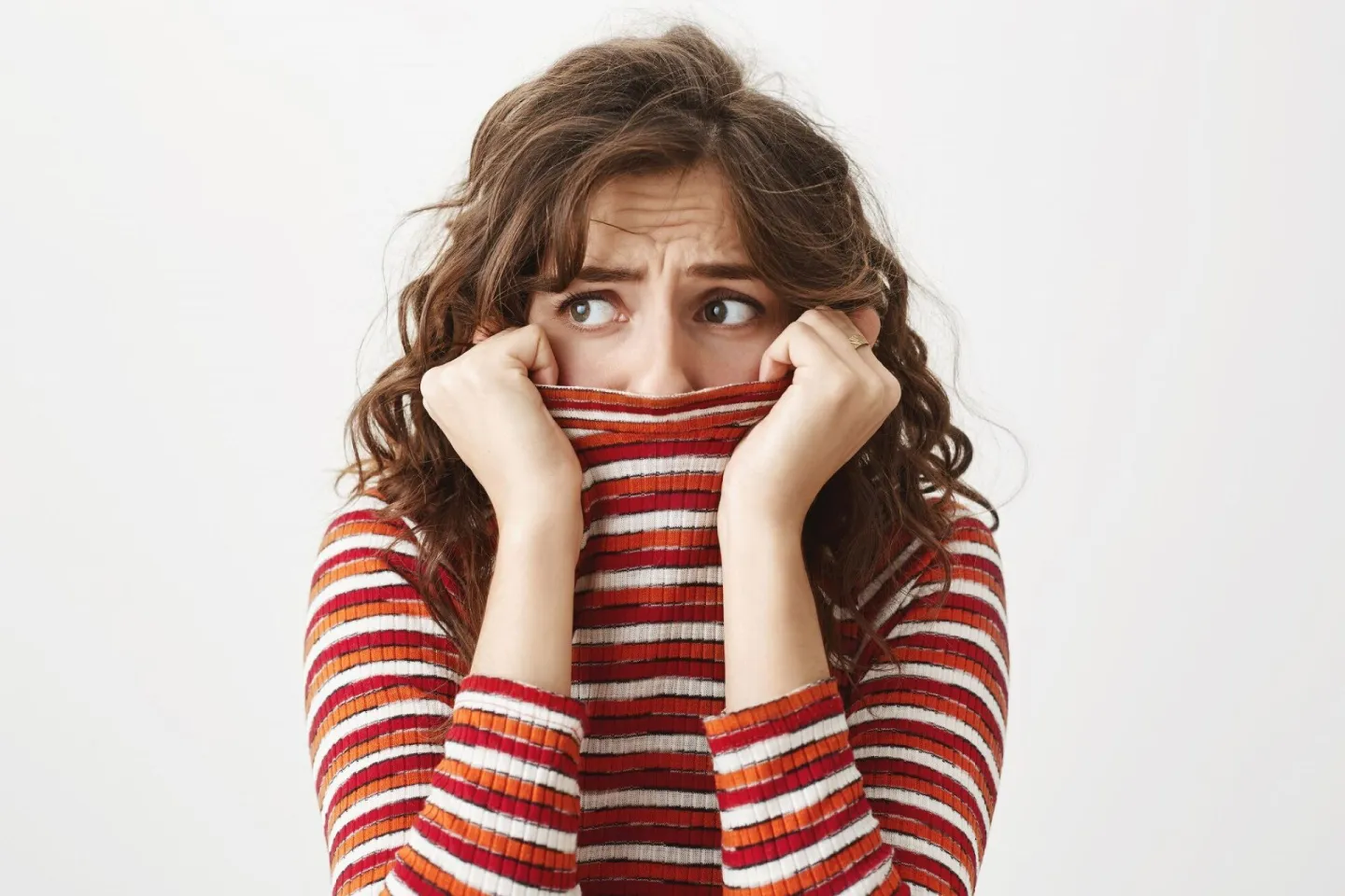 Scared timid woman looking left, shivering and