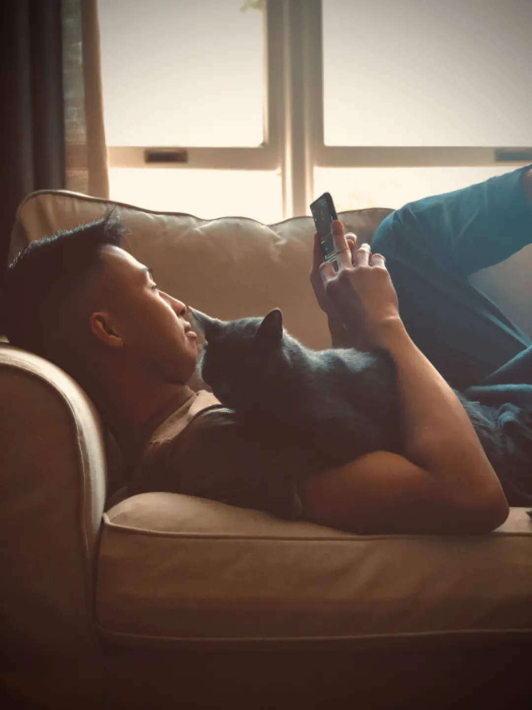 male relaxing with cat