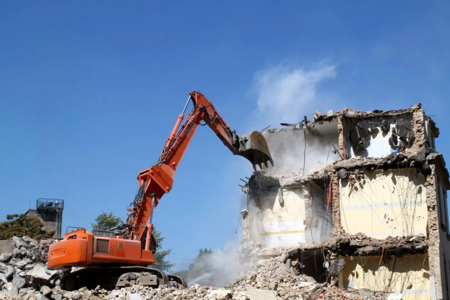 Digger demolishes building in site clearance operation