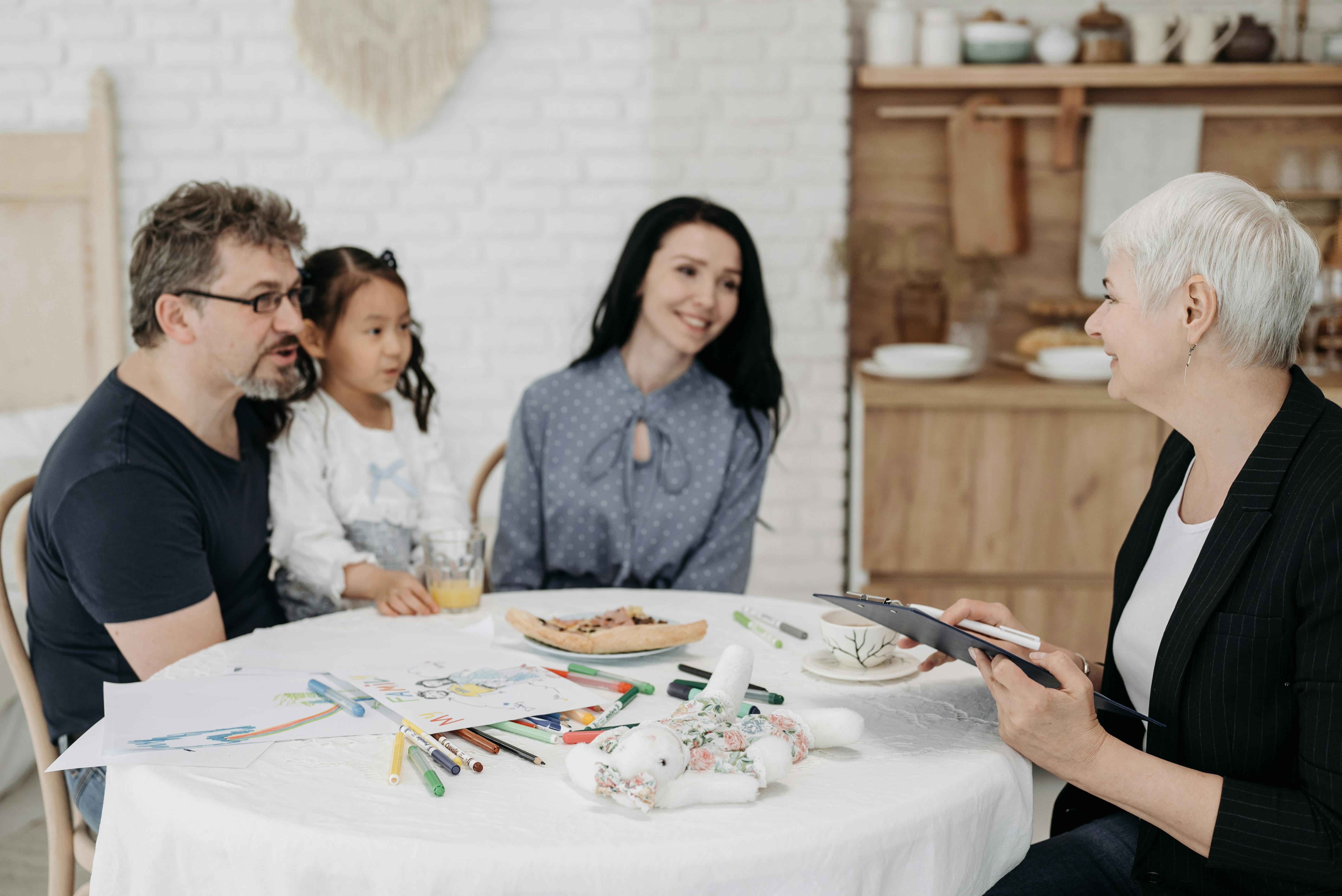 Adoptive family discussing with a social worker