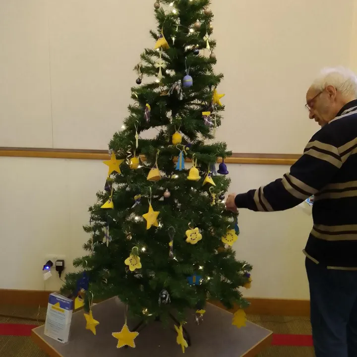 2025 u3a Christmas tree with blue and yellow decorations