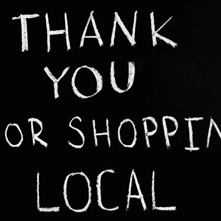 A chalkboard with handwritten message thanking