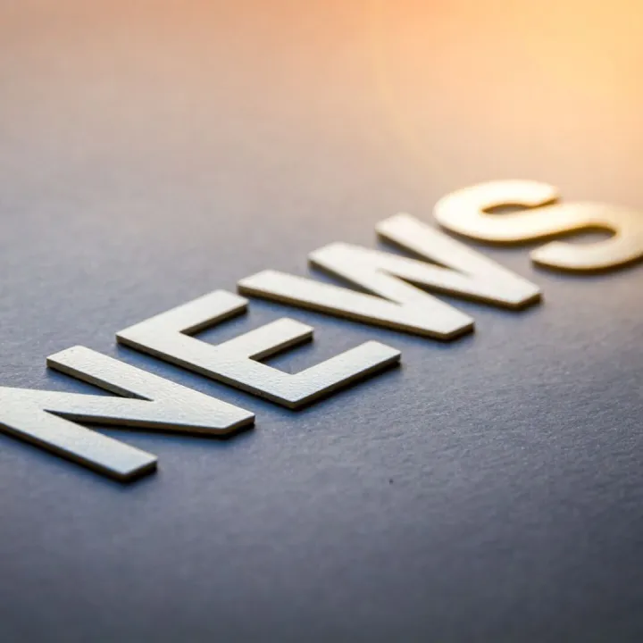 Word news written with white solid letters