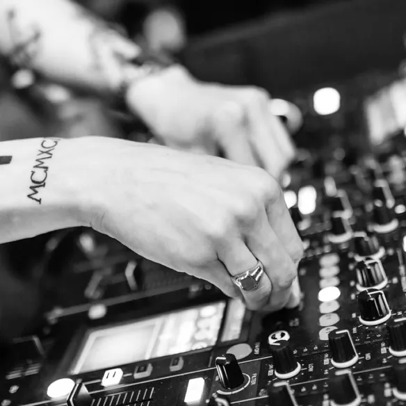 Hands on the mixer, monochrome