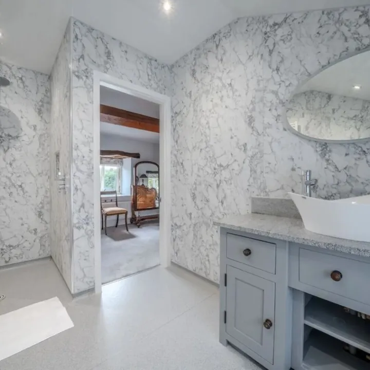 The marble en-suite wet room to bedroom one