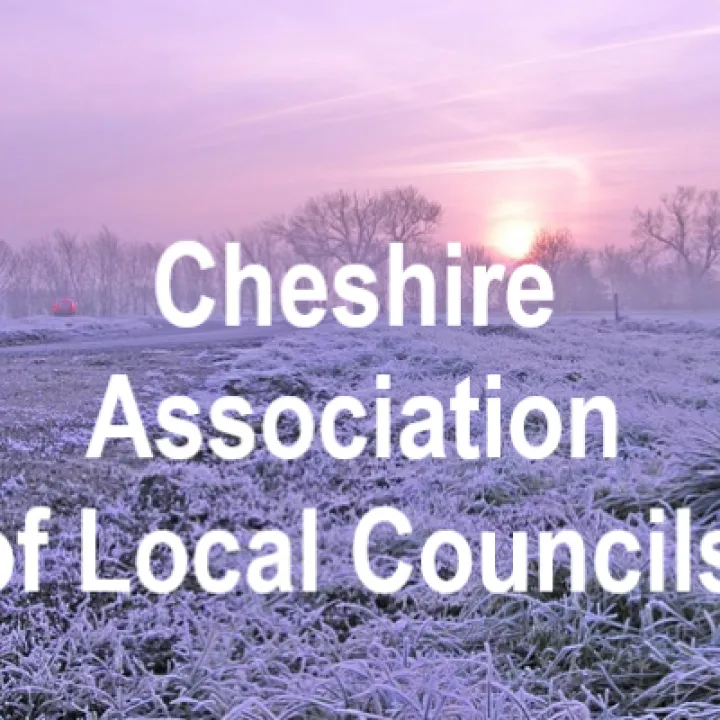 Cheshire Association of Local Councils written over a frosty field at sunrise
