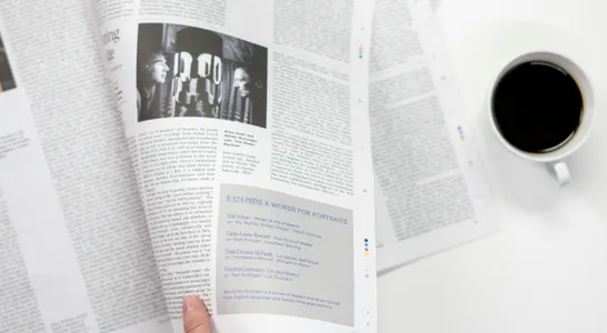 Person Holding White Printer Paper