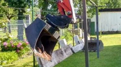 Mini digger in a domestic garden