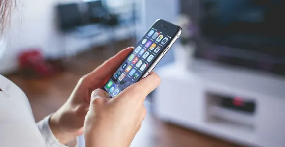 Woman Wearing White V Neck Shirt Using Space Gray Iphone 6