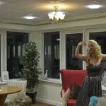 Bexi Owen singing to dementia residents limewood