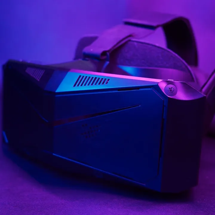 Front view of the Pimax Crystal Light 1 VR headset with magenta backgroundlighting