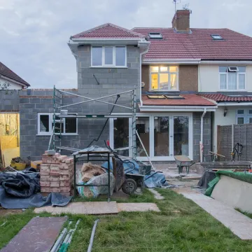 A suburban house undergoing major renovations with